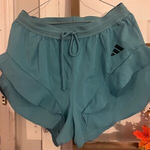 Pre~loved Adidas Women's large Teal Athletic Shorts with frills on legs.